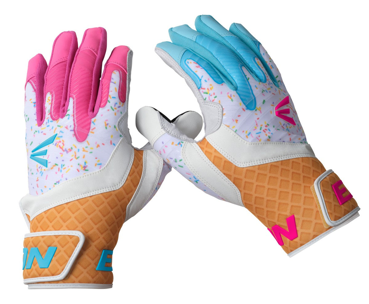 Four colors of batting gloves hanging in a dugout