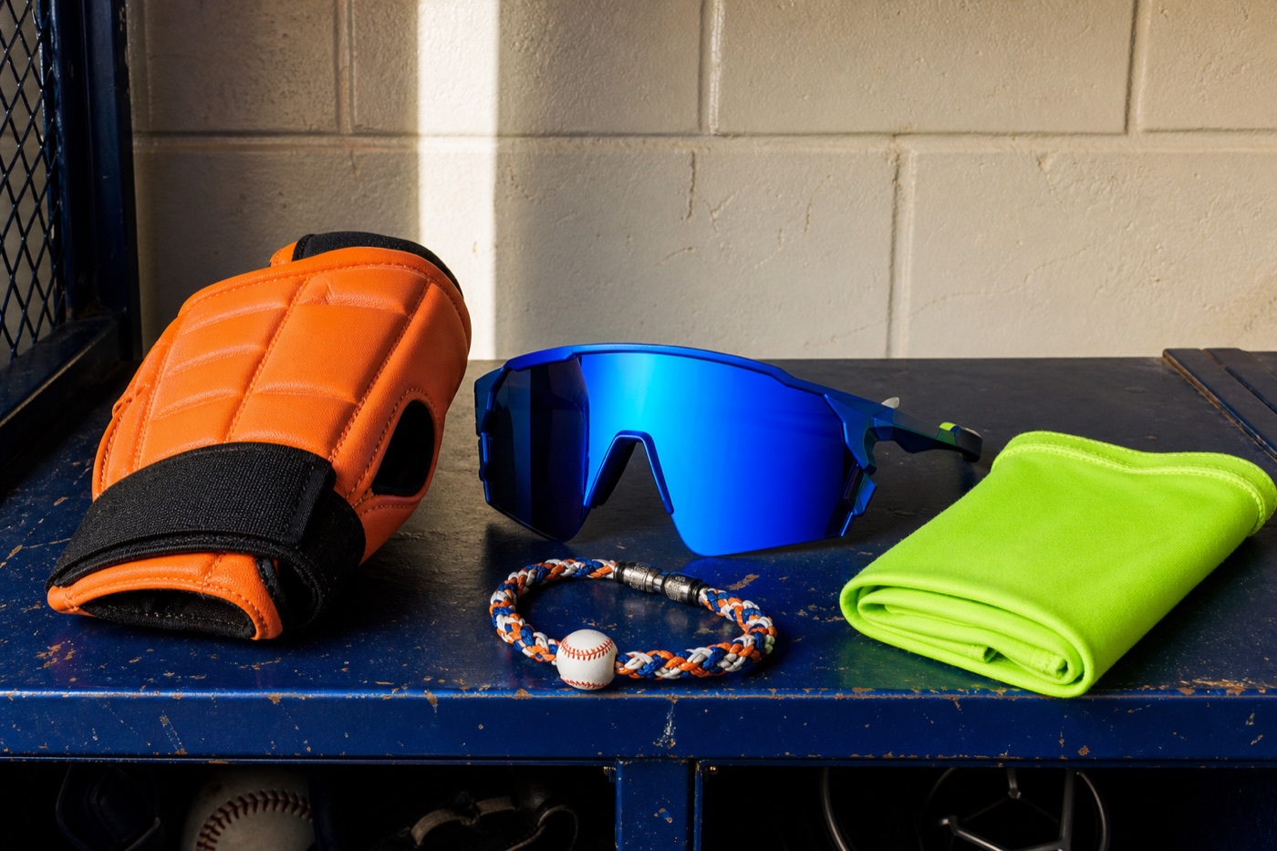 Sliding mitt, sport sunglasses, arm sleeve, and baseball necklace